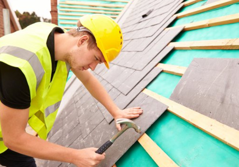 professional tiler working on external tiling