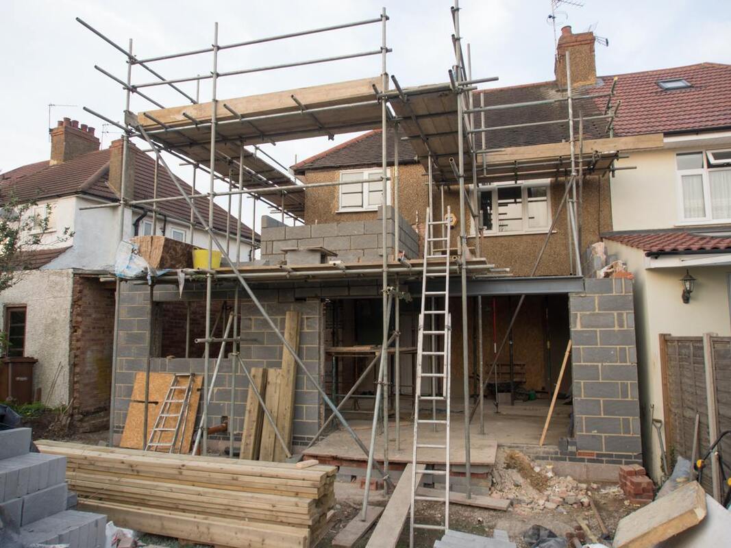 professional tiler working on external tiling 